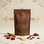 Azomally cacao tea Cacao Spice package with cinnamon sticks, star anise, ginger and cacao beans on a patterned background