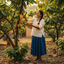 Woman harvesting cacao fruits in a cacao field 
