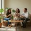 Three people sitting around a wooden table in a bright room with plants sharing cookies and cacao tea.